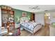 Comfortable bedroom with a large bed, natural light, and attached bathroom at 4646 Longwater Chase # 98, Sarasota, FL 34235