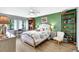 Beautiful bedroom featuring natural light, comfortable bed, and built-in shelving at 4646 Longwater Chase # 98, Sarasota, FL 34235