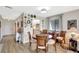 View of the dining area with wood floors featuring a table with four chairs at 4646 Longwater Chase # 98, Sarasota, FL 34235