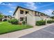 Attractive condo featuring private entrances, covered balconies, and well-kept lawns at 4646 Longwater Chase # 98, Sarasota, FL 34235