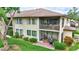 This home features a screened lanai, covered balcony, and lovely landscaping for outdoor living at 4646 Longwater Chase # 98, Sarasota, FL 34235