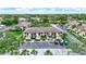 Well-maintained condo building with lush landscaping and convenient parking at 4646 Longwater Chase # 98, Sarasota, FL 34235