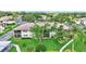 Beautiful front exterior view with lush landscaping, covered balconies, and ample parking at 4646 Longwater Chase # 98, Sarasota, FL 34235