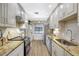 Updated kitchen featuring granite countertops, stainless steel appliances, and modern cabinetry at 4646 Longwater Chase # 98, Sarasota, FL 34235