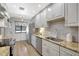 This updated kitchen features granite counters, stainless steel appliances, white cabinets and lots of storage at 4646 Longwater Chase # 98, Sarasota, FL 34235