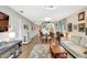 Bright living room featuring a dining space, modern lighting, and open layout at 4646 Longwater Chase # 98, Sarasota, FL 34235