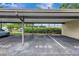 Assigned parking space in a covered parking lot with easy access to the building at 4646 Longwater Chase # 98, Sarasota, FL 34235