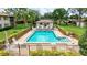 Community pool with bath house and plenty of space to sunbathe and relax at 4646 Longwater Chase # 98, Sarasota, FL 34235