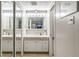 Bathroom with a mirrored cabinet, vanity, and sink at 491 Cervina Dr, Venice, FL 34285