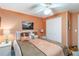 Bedroom featuring a ceiling fan, window, and bed with decorative pillows at 491 Cervina Dr, Venice, FL 34285