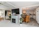 Open floor plan view from the living area into the dining and kitchen, featuring modern appliances and decor at 491 Cervina Dr, Venice, FL 34285