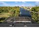 Aerial view of a home with a screened lanai and dock; perfect for a waterfront lifestyle at 5140 Administration St, Port Charlotte, FL 33948