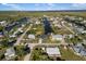 An aerial view showcasing a waterfront community with lush greenery and canal access at 5140 Administration St, Port Charlotte, FL 33948