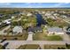 Aerial view of a waterfront home in a charming residential neighborhood with canal access at 5140 Administration St, Port Charlotte, FL 33948