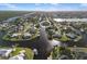 Wide aerial view of the home's location on a waterway with canal access in a quiet neighborhood at 5140 Administration St, Port Charlotte, FL 33948