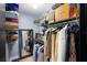 Organized walk-in closet featuring shelving, hanging racks, and ample storage space for clothes and accessories at 5140 Administration St, Port Charlotte, FL 33948
