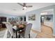 Spacious dining area featuring tufted chairs, sleek dark wood table, and bright lighting at 5140 Administration St, Port Charlotte, FL 33948