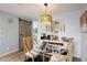 Charming dining area with a modern light fixture and adjacent coffee bar at 5140 Administration St, Port Charlotte, FL 33948