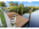 Waterfront home featuring a private dock perfect for boating, fishing, and enjoying the waterway at 5140 Administration St, Port Charlotte, FL 33948