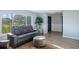 Cozy living room featuring a comfortable reclining sofa, ottoman, and stylish decor at 5140 Administration St, Port Charlotte, FL 33948