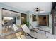 Relax in this covered patio with comfortable lounge chairs and easy access to the dining room through sliding glass doors at 5140 Administration St, Port Charlotte, FL 33948