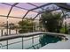 Enjoy a twilight swim in this peaceful pool with sunset views of the canal and clear skies at 5140 Administration St, Port Charlotte, FL 33948