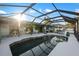 Relax by the screened-in pool with an outdoor kitchen, dining area, and plenty of space for entertaining and enjoying the sunshine at 5140 Administration St, Port Charlotte, FL 33948