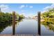 A wooden dock sits ready for boats and relaxation, with serene views of the waterway at 5140 Administration St, Port Charlotte, FL 33948