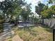 Grassy backyard with mature foliage at 602 Bonito Ave, Nokomis, FL 34275