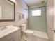 Modern bathroom with a sleek glass-enclosed shower, updated vanity, and tiled walls at 602 Bonito Ave, Nokomis, FL 34275