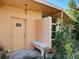 Exterior entryway with tiled bench and well lit with greenery at 602 Bonito Ave, Nokomis, FL 34275