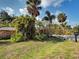 Lush front yard boasting a variety of tropical plants and manicured landscaping at 602 Bonito Ave, Nokomis, FL 34275