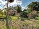 This quaint home has a verdant front yard and mature landscaping at 602 Bonito Ave, Nokomis, FL 34275