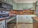 Kitchen with stainless steel appliances, wood countertop, and tile backsplash at 602 Bonito Ave, Nokomis, FL 34275