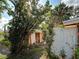 Storage shed in the backyard is surrounded by greenery, enhancing the property's appeal at 602 Bonito Ave, Nokomis, FL 34275