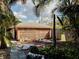 View of a quaint shed surrounded by tropical vegetation and foliage at 602 Bonito Ave, Nokomis, FL 34275
