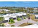 Aerial shot of single Gathering home with a well-manicured yard in a waterfront community at 608 Fair Winds Dr # 608, Nokomis, FL 34275