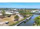Aerial view of the coastal community featuring waterfront property and boat docks at 608 Fair Winds Dr # 608, Nokomis, FL 34275