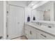 A bright bathroom featuring a large vanity, marble countertop, and modern fixtures at 608 Fair Winds Dr # 608, Nokomis, FL 34275