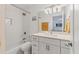 Bathroom featuring a tub with shower, and a marble vanity with sink and fixtures at 608 Fair Winds Dr # 608, Nokomis, FL 34275
