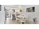 Charming dining area next to kitchen featuring a round table and seating for four at 608 Fair Winds Dr # 608, Nokomis, FL 34275