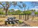 Fenced dog park with picnic table and shade trees available for resident enjoyment at 608 Fair Winds Dr # 608, Nokomis, FL 34275