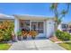 Beautiful front porch with tasteful decor, perfect for enjoying the outdoors in comfort and style at 608 Fair Winds Dr # 608, Nokomis, FL 34275