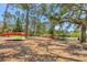 Large, shaded kayak and canoe storage area with mature trees at this waterfront community at 608 Fair Winds Dr # 608, Nokomis, FL 34275