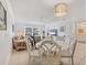 Open living space combines dining and living area creating a cohesive and inviting atmosphere at 608 Fair Winds Dr # 608, Nokomis, FL 34275