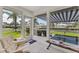 Canal-front home with sunroom, water views, and tiled floor at 608 Fair Winds Dr # 608, Nokomis, FL 34275