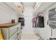 Well-organized walk-in closet with custom shelves and hanging rods for optimal storage at 608 Fair Winds Dr # 608, Nokomis, FL 34275
