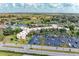 Aerial view showcasing the condo complex with well-maintained landscaping and surrounding community amenities at 618 Bird Bay S Dr # 110, Venice, FL 34285