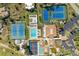 A bird's eye view of tennis courts, swimming pool, clubhouse and well kept grounds at 618 Bird Bay S Dr # 110, Venice, FL 34285
