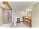 Spacious bathroom with tiled walk-in shower and wood vanity at 618 Bird Bay S Dr # 110, Venice, FL 34285